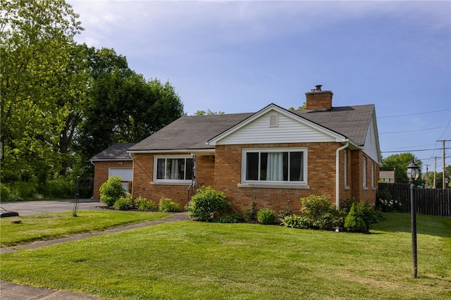 304 Simpson Rd, Irondequoit, NY 14617 - view of front of home with brick siding, a chimney, driveway, and roof with shingles