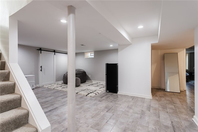 304 Simpson Rd, Irondequoit, NY 14617 - below grade area with stairs, a barn door, light wood-style floors, and recessed lighting