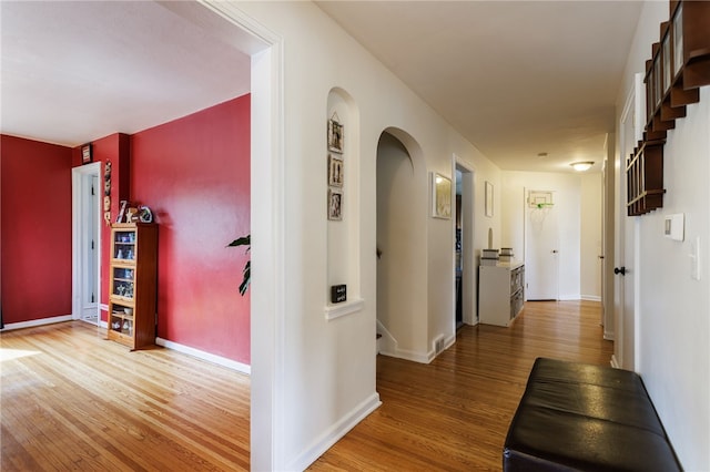 304 Simpson Rd, Irondequoit, NY 14617 - corridor with arched walkways and wood finished floors