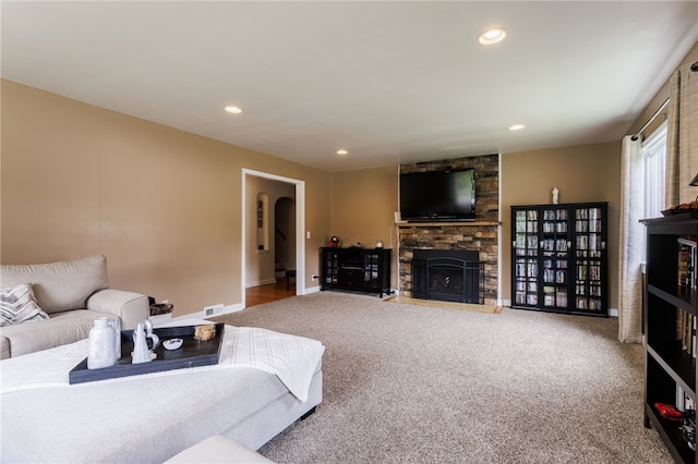304 Simpson Rd, Irondequoit, NY 14617 - living room with a fireplace, carpet, recessed lighting, and arched walkways