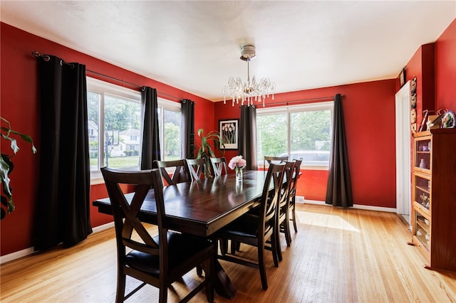 304 Simpson Rd, Irondequoit, NY 14617 - dining room with a chandelier and light wood-style flooring