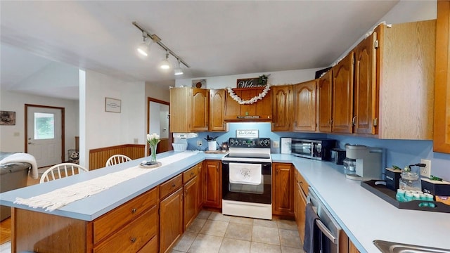 9447 County Route 75, Pulteney, NY 14418 - kitchen with range with electric stovetop, dishwasher, light countertops, and brown cabinetry