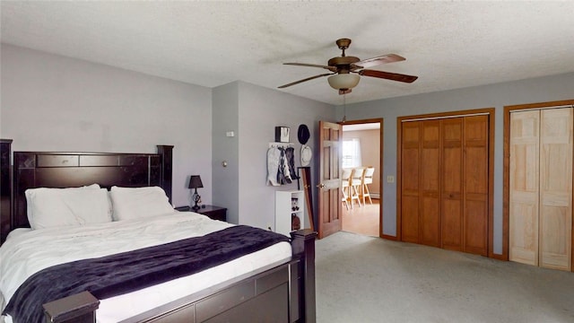 9447 County Route 75, Pulteney, NY 14418 - carpeted bedroom with multiple closets, ceiling fan, and a textured ceiling