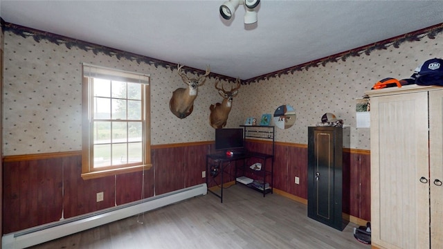 9447 County Route 75, Pulteney, NY 14418 - office area with baseboard heating, wainscoting, wood walls, and wood finished floors