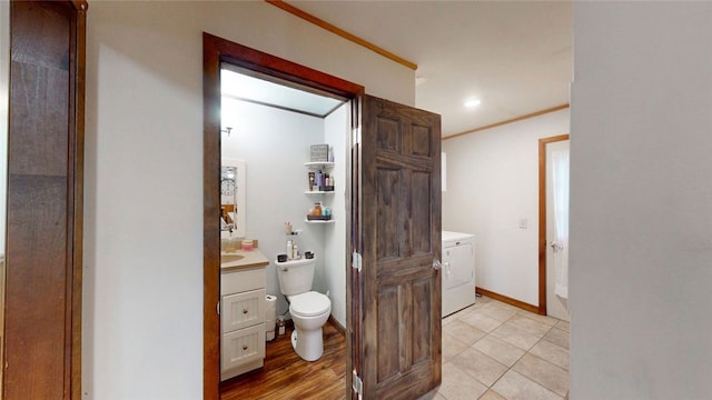 9447 County Route 75, Pulteney, NY 14418 - bathroom featuring vanity, tile patterned flooring, ornamental molding, and independent washer and dryer