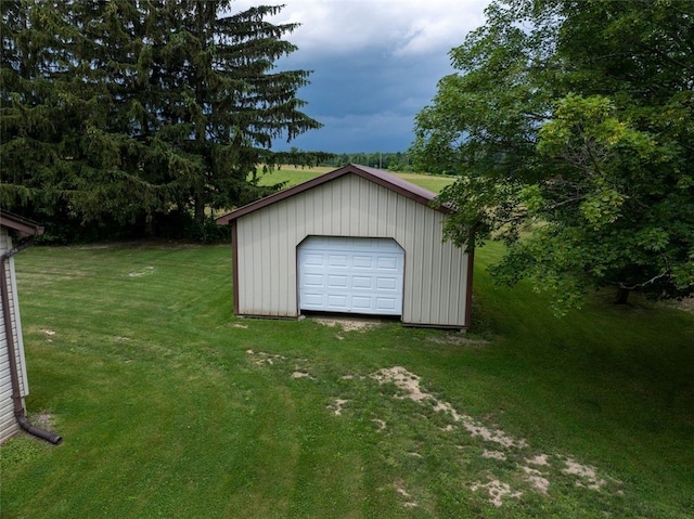 9447 County Route 75, Pulteney, NY 14418 - view of grassy yard with an outbuilding, a garage, and driveway