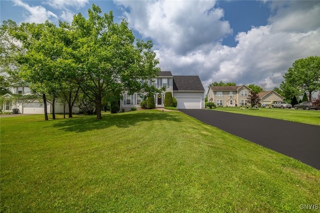 110 Clark Cir, Lenox, NY 13032 - view of front of home with asphalt driveway, a front yard, and a residential view