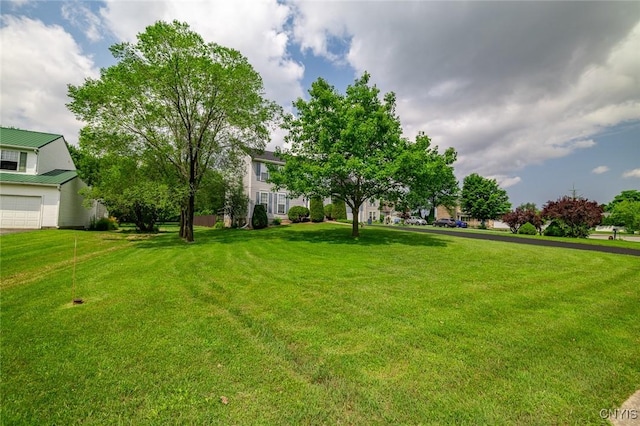 110 Clark Cir, Lenox, NY 13032 - view of grassy yard featuring a garage