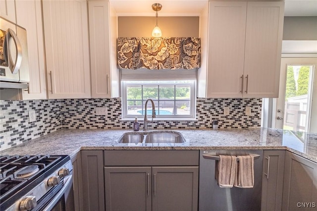 110 Clark Cir, Lenox, NY 13032 - kitchen featuring appliances with stainless steel finishes, healthy amount of natural light, and decorative backsplash