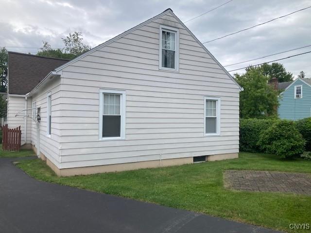 820 James St, Utica, NY 13501 - view of side of property featuring a lawn