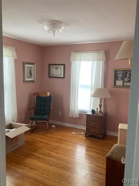 820 James St, Utica, NY 13501 - sitting room with wood finished floors and baseboards