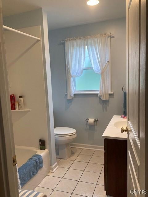 820 James St, Utica, NY 13501 - bathroom featuring tile patterned flooring, vanity, and shower / bathtub combination