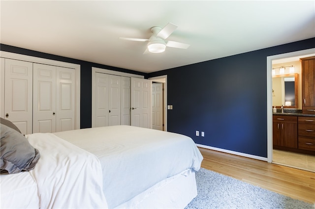 7 Chipping Rdg, Perinton, NY 14450 - bedroom with light wood finished floors, multiple closets, ensuite bath, and a ceiling fan