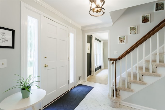 7 Chipping Rdg, Perinton, NY 14450 - foyer featuring stairway, ornamental molding, light tile patterned flooring, and a chandelier