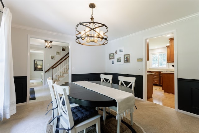 7 Chipping Rdg, Perinton, NY 14450 - dining space with light carpet, a chandelier, crown molding, stairway, and wainscoting