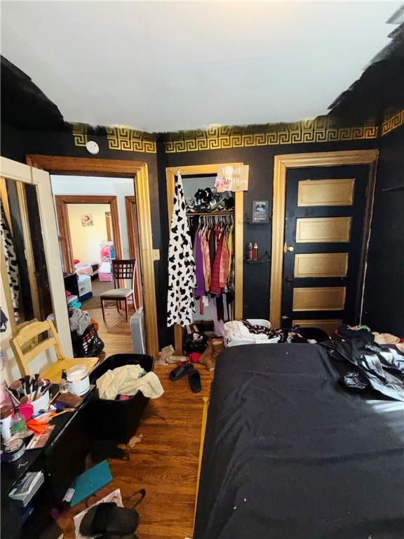 256 Durnan St, Rochester, NY 14621 - bedroom with a closet and wood finished floors
