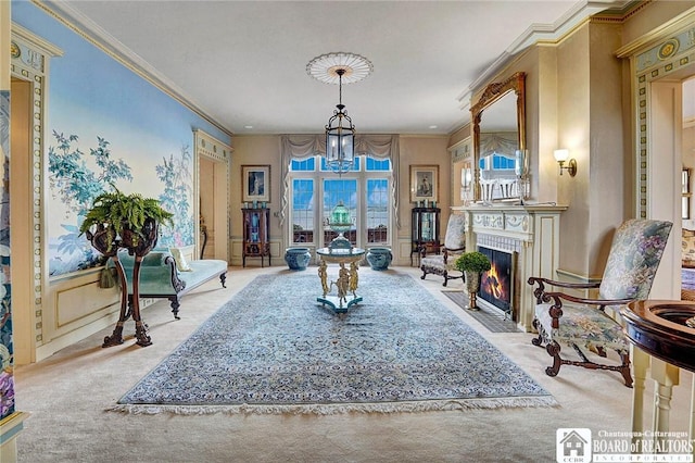 10 Elm Ln, Chautauqua, NY 14722 - dining space featuring carpet floors, a chandelier, ornamental molding, and a fireplace with flush hearth