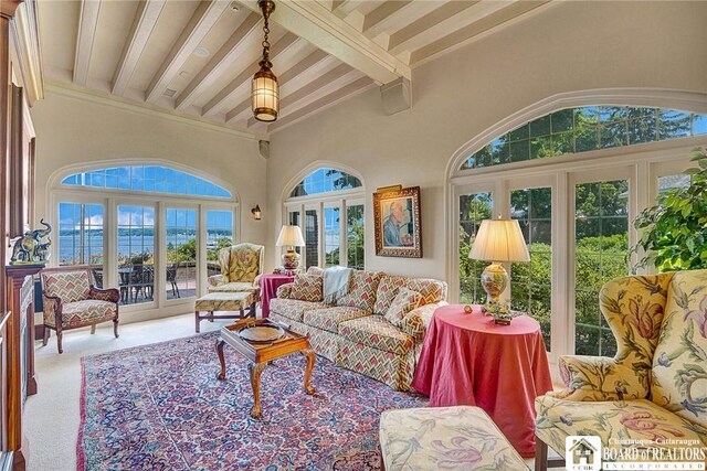 10 Elm Ln, Chautauqua, NY 14722 - carpeted living area with beam ceiling and a towering ceiling