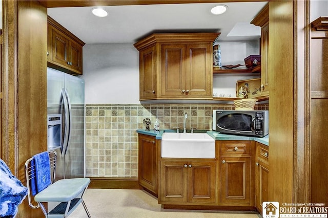 10 Elm Ln, Chautauqua, NY 14722 - kitchen with stainless steel appliances, brown cabinetry, light countertops, open shelves, and tile walls