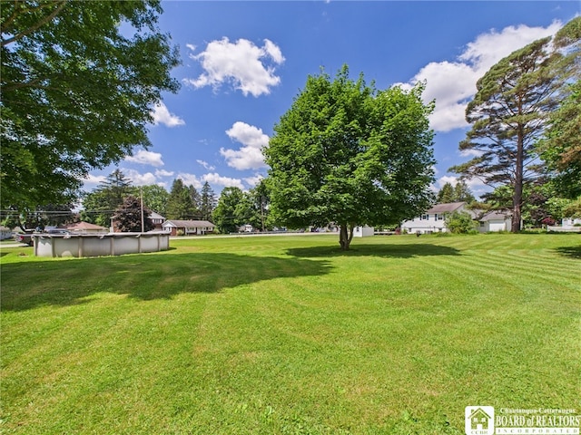 1683 Haskell Rd, Portville, NY 14760 - view of green lawn with a covered pool