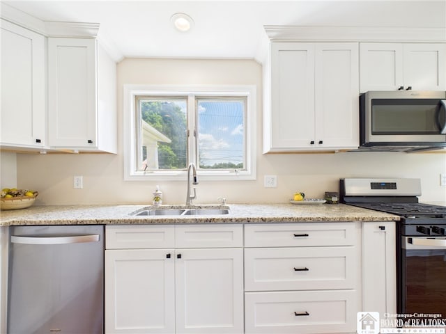 1683 Haskell Rd, Portville, NY 14760 - kitchen with appliances with stainless steel finishes, white cabinets, and light stone counters