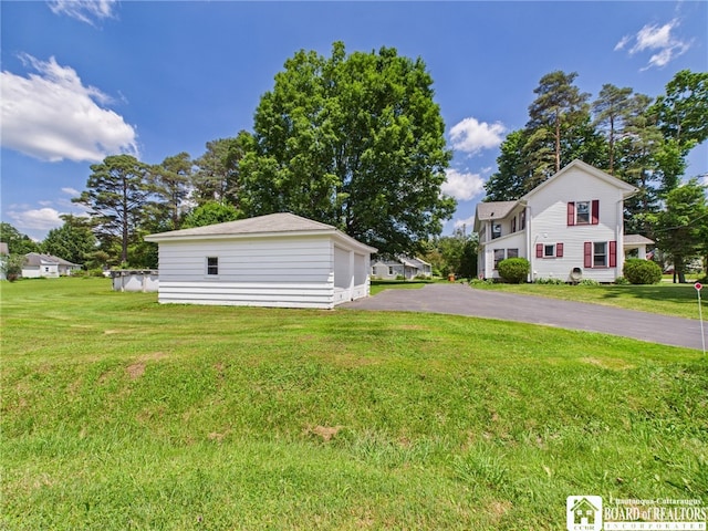 1683 Haskell Rd, Portville, NY 14760 - view of green lawn with an outdoor structure and a detached garage