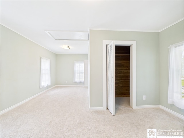 1683 Haskell Rd, Portville, NY 14760 - unfurnished bedroom with carpet, attic access, crown molding, a closet, and a walk in closet