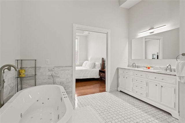 114-116 Main St Unit 114, Milo, NY 14527 - bathroom featuring double vanity, a jetted tub, and connected bathroom