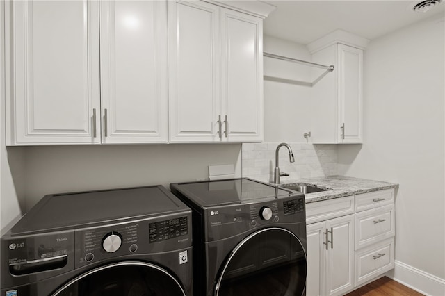 114-116 Main St Unit 114, Milo, NY 14527 - washroom featuring independent washer and dryer, cabinet space, and wood finished floors