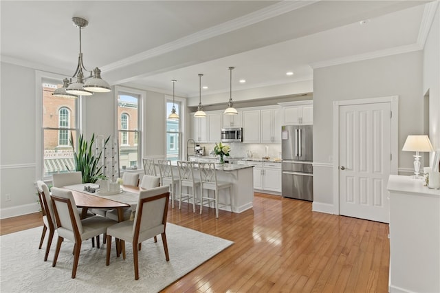 114-116 Main St Unit 114, Milo, NY 14527 - dining space with healthy amount of natural light, light wood-style flooring, crown molding, and recessed lighting