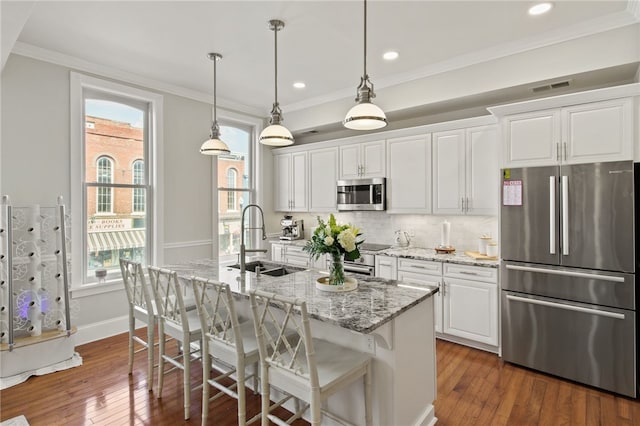 114-116 Main St Unit 114, Milo, NY 14527 - kitchen featuring stainless steel appliances, white cabinetry, tasteful backsplash, ornamental molding, and recessed lighting