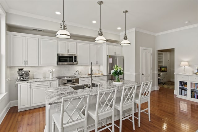 114-116 Main St Unit 114, Milo, NY 14527 - kitchen with stainless steel appliances, hardwood / wood-style floors, tasteful backsplash, white cabinets, and crown molding