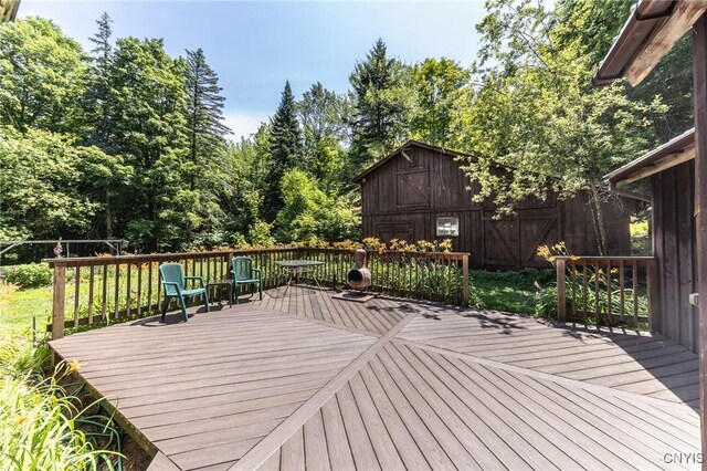 7940 Soft Maple Rd, New Bremen, NY 13327 - wooden terrace with a barn