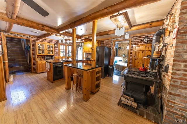 7940 Soft Maple Rd, New Bremen, NY 13327 - kitchen with freestanding refrigerator, a center island, light wood finished floors, dark countertops, and beamed ceiling
