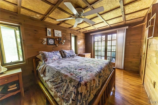 7940 Soft Maple Rd, New Bremen, NY 13327 - bedroom with wooden walls, wood-type flooring, and coffered ceiling