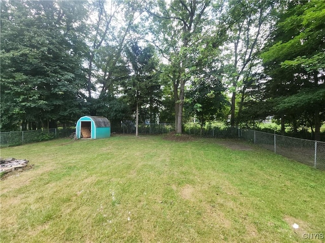 201 Jane Dr, Camillus, NY 13219 - fenced backyard with a storage shed and view of scattered trees