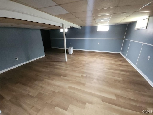 201 Jane Dr, Camillus, NY 13219 - below grade area featuring wood finished floors and a paneled ceiling