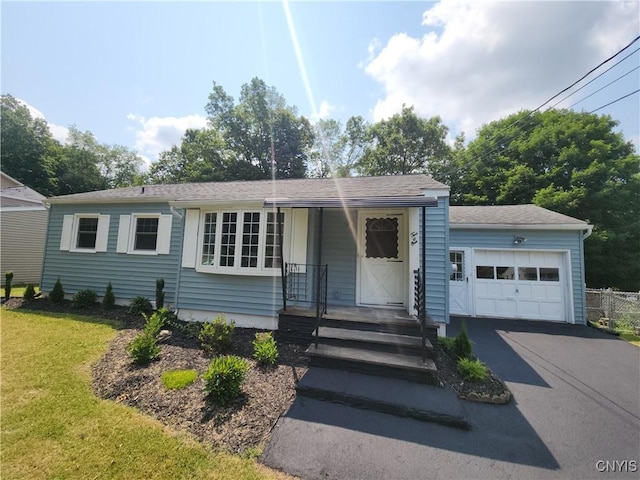 201 Jane Dr, Camillus, NY 13219 - single story home featuring asphalt driveway, a front yard, and roof with shingles