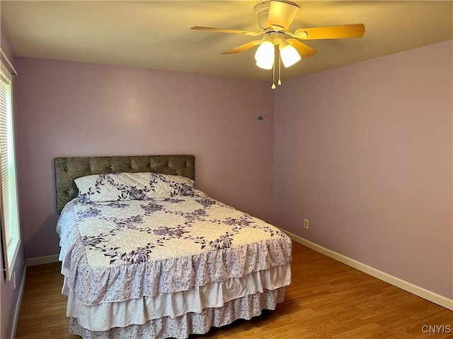 520 Seneca St, Fulton, NY 13069 - bedroom featuring wood finished floors and a ceiling fan