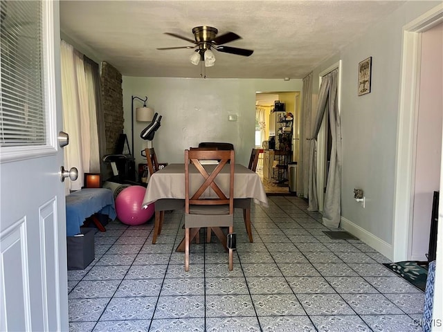 520 Seneca St, Fulton, NY 13069 - dining room featuring a ceiling fan and light tile patterned floors