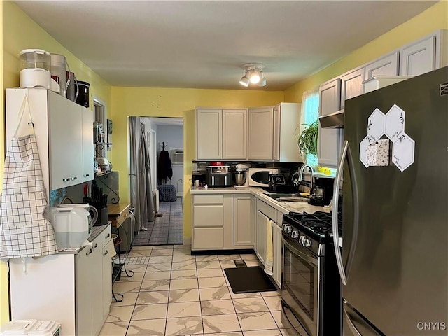 520 Seneca St, Fulton, NY 13069 - kitchen featuring freestanding refrigerator, gas range, light marble finish floors, and light countertops