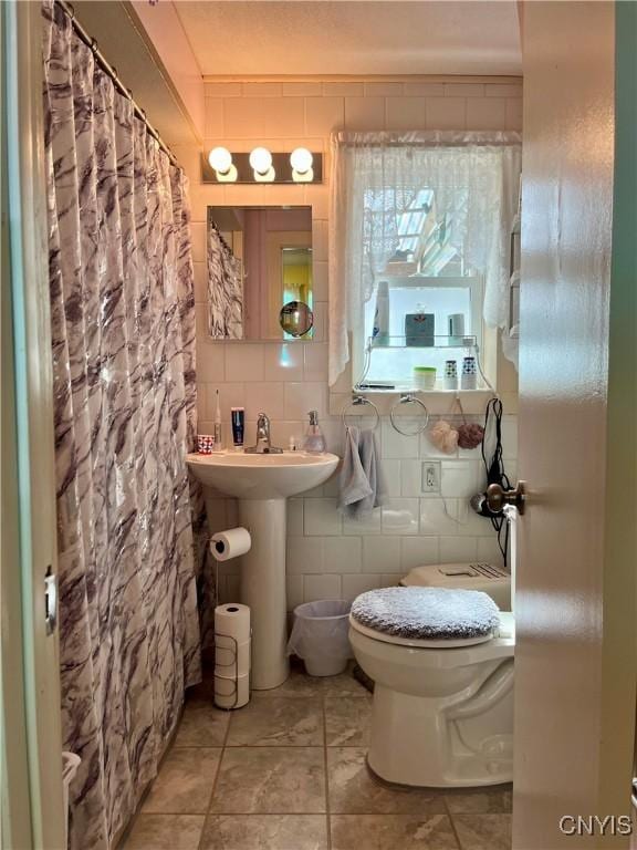 520 Seneca St, Fulton, NY 13069 - bathroom featuring tile walls and tile patterned floors