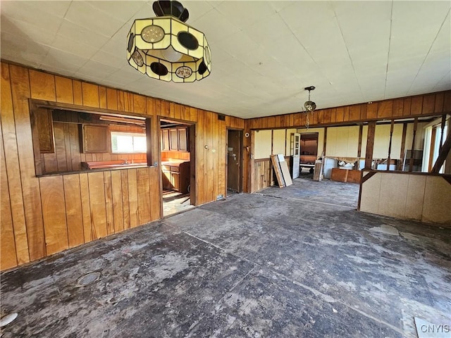 7131 State Route 8, Deerfield, NY 13502 - unfurnished living room featuring wood walls
