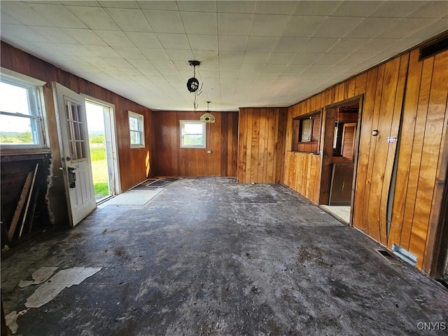 7131 State Route 8, Deerfield, NY 13502 - unfurnished dining area featuring wooden walls
