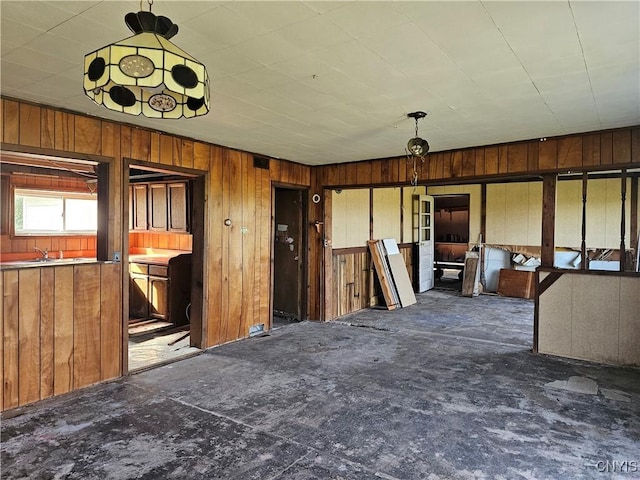 7131 State Route 8, Deerfield, NY 13502 - unfurnished living room featuring wooden walls