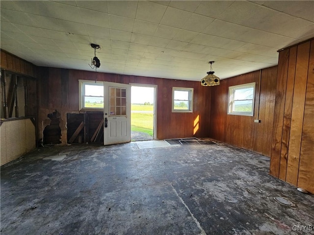 7131 State Route 8, Deerfield, NY 13502 - unfurnished dining area featuring wood walls