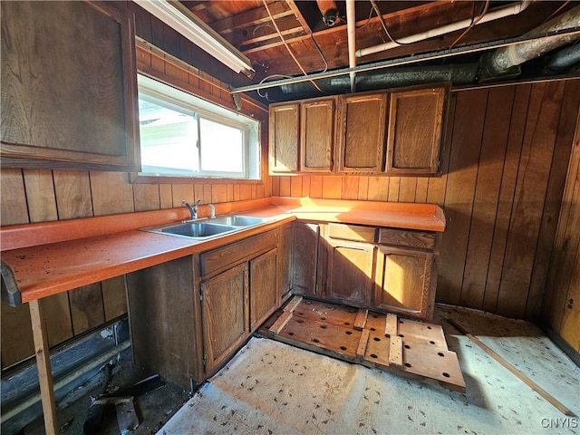 7131 State Route 8, Deerfield, NY 13502 - kitchen featuring wooden walls and light countertops