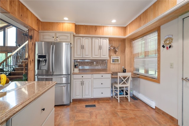 734 Post Rd, Franklin, NY 13775 - kitchen with stainless steel refrigerator with ice dispenser, a baseboard heating unit, recessed lighting, light countertops, and light tile patterned floors