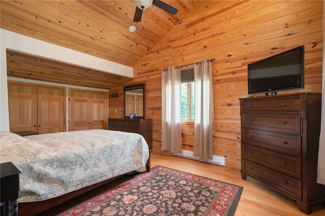 734 Post Rd, Franklin, NY 13775 - bedroom with light wood-style floors, vaulted ceiling, wood walls, a ceiling fan, and wooden ceiling