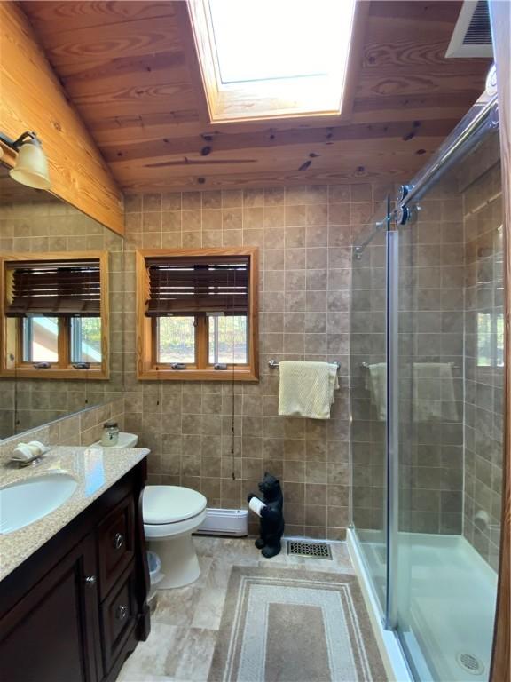 734 Post Rd, Franklin, NY 13775 - full bath with vanity, a stall shower, wooden ceiling, and vaulted ceiling